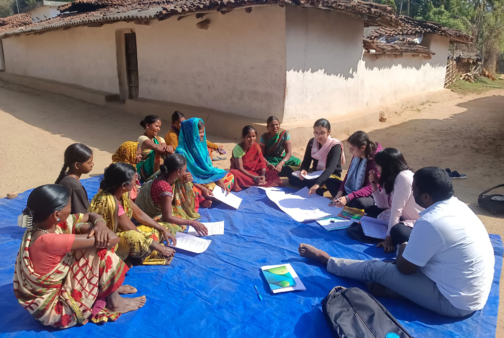 Researchers from The George Institute India leading a Food Systems research project information session with women from a community in Sarguja, Chattisgarh, India. The project is part of the NIHR Global Health Research Centre for Non-Communicable Diseases and Environmental Change collaboration. 