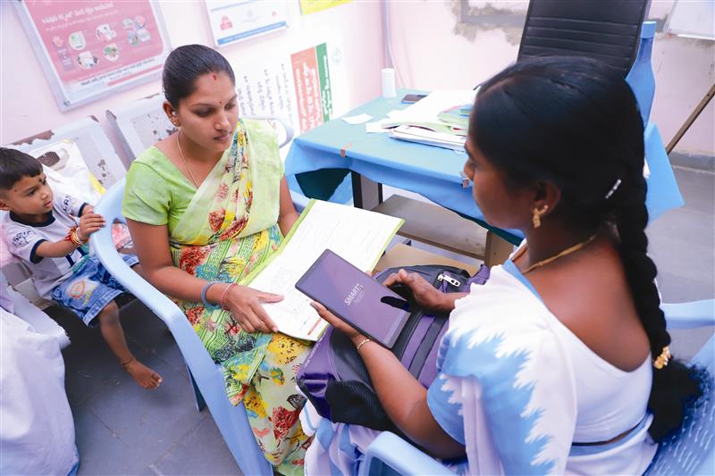 Woman using SMARTHealth app in a clinical setting