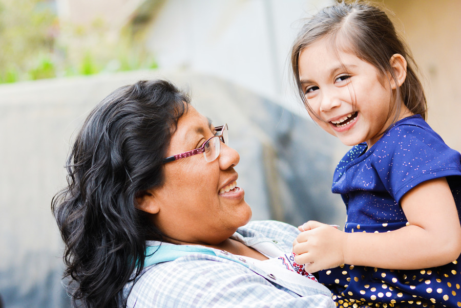 Woman holding a little girl