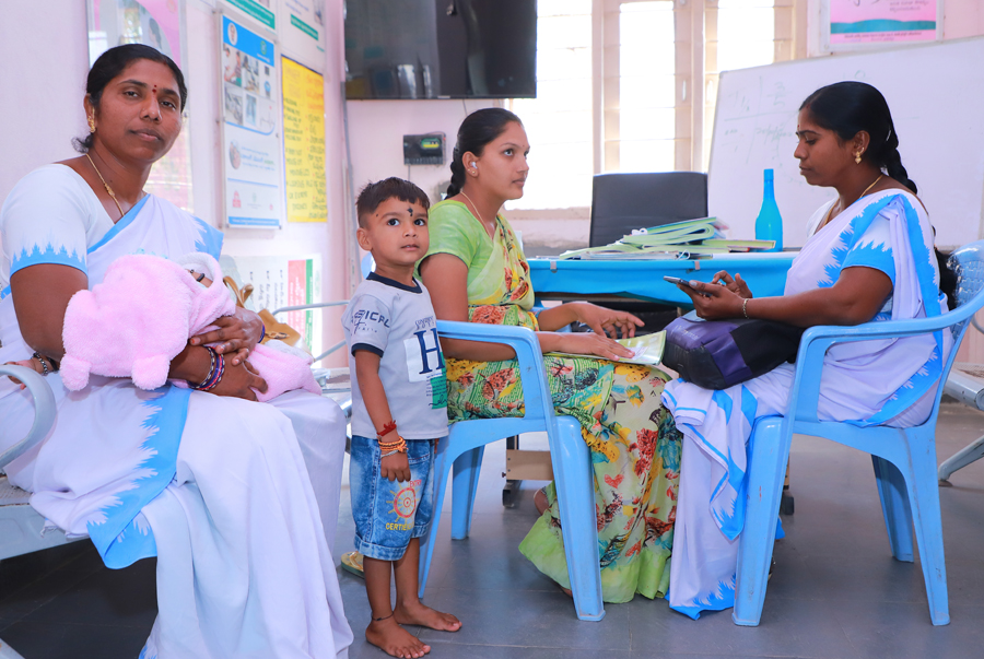 A young mother and newborn attending a health consultation through the SMARThealth Pregnancy project, at the Primary Health Care Centre in Bejjanki, Siddipet India