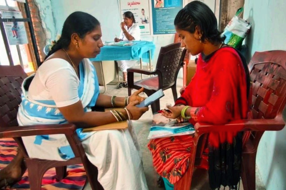 ASHA workers screening a pregnant woman